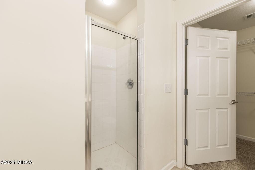 303 Cottage Lane Macon, GA 31210 - Photo 26 of 29 a bathroom with a shower