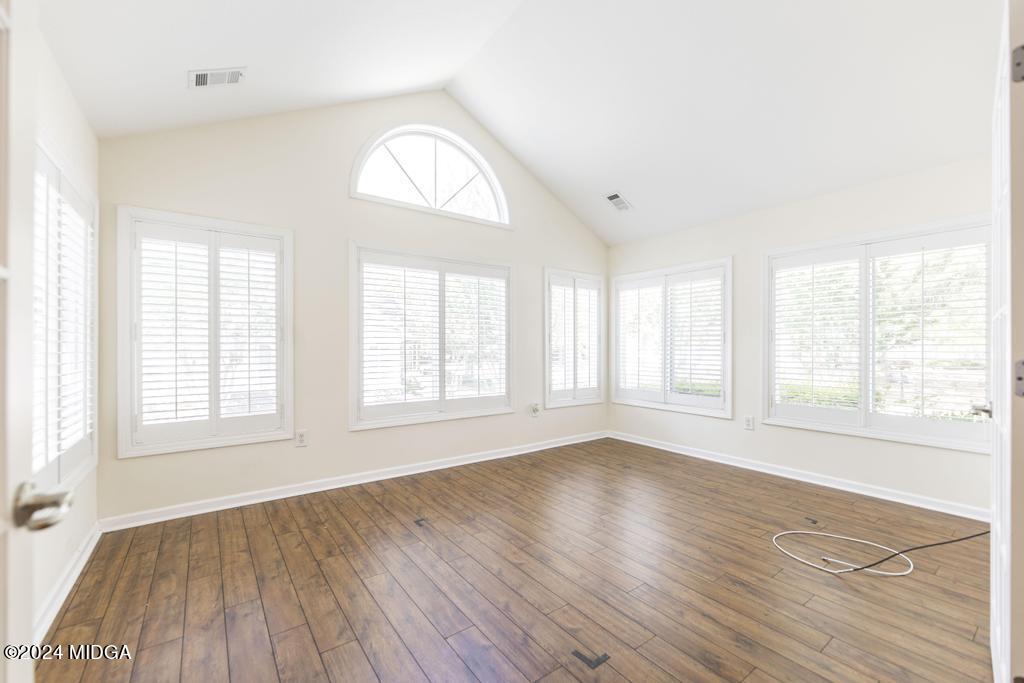 303 Cottage Lane Macon, GA 31210 - Photo 28 of 29 an empty room with wooden floor window and windows