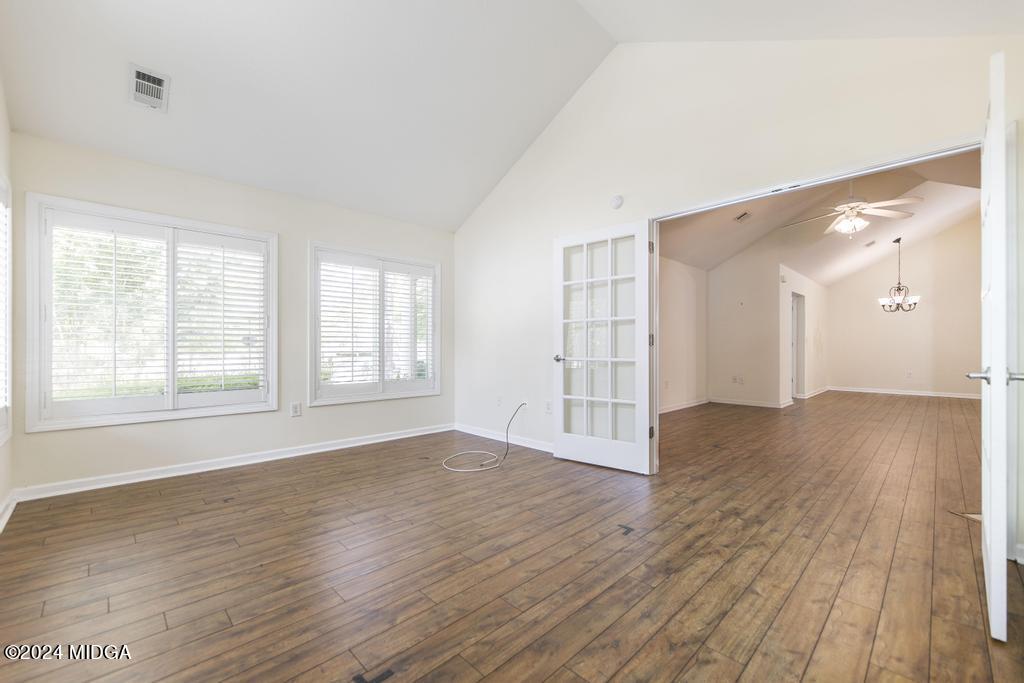 303 Cottage Lane Macon, GA 31210 - Photo 29 of 29 an empty room with wooden floor and windows