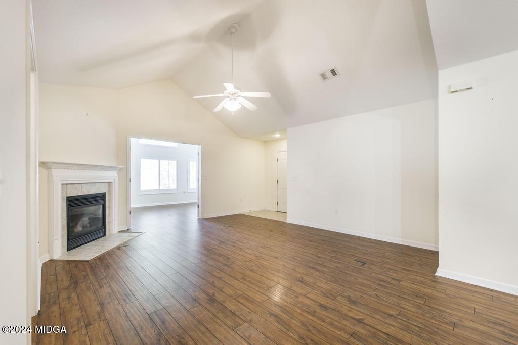 303 Cottage Lane Macon, GA 31210 - Photo 10 of 29 a view of empty room with wooden floor and fireplace