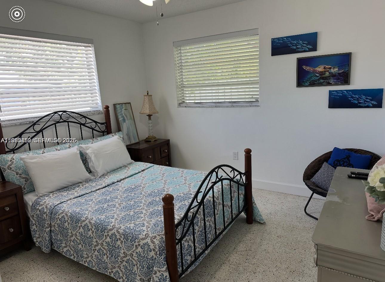 38 Silver Springs Drive Key Largo, FL 33037 - Photo 5 of 8 a bedroom with a bed a dresser and a window