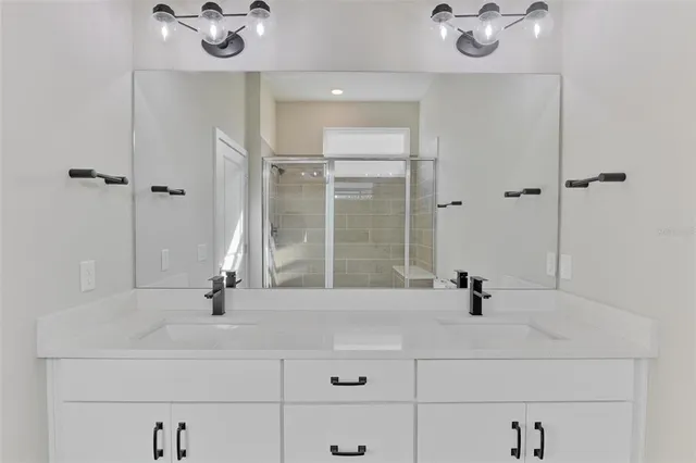 a bathroom with a sink and mirror