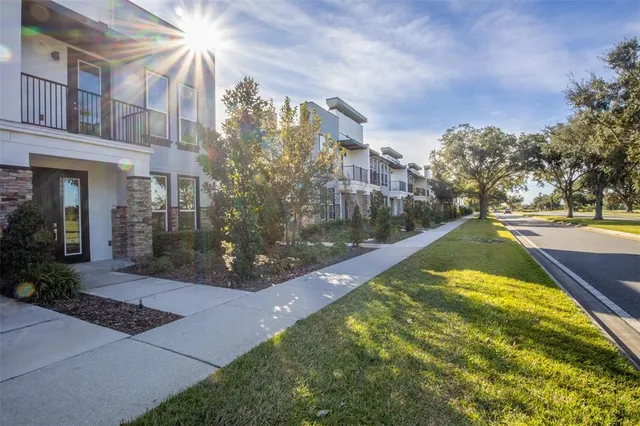 a kitchen with refrigerator and white table