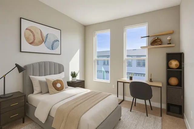 a bedroom with a bed and cabinets