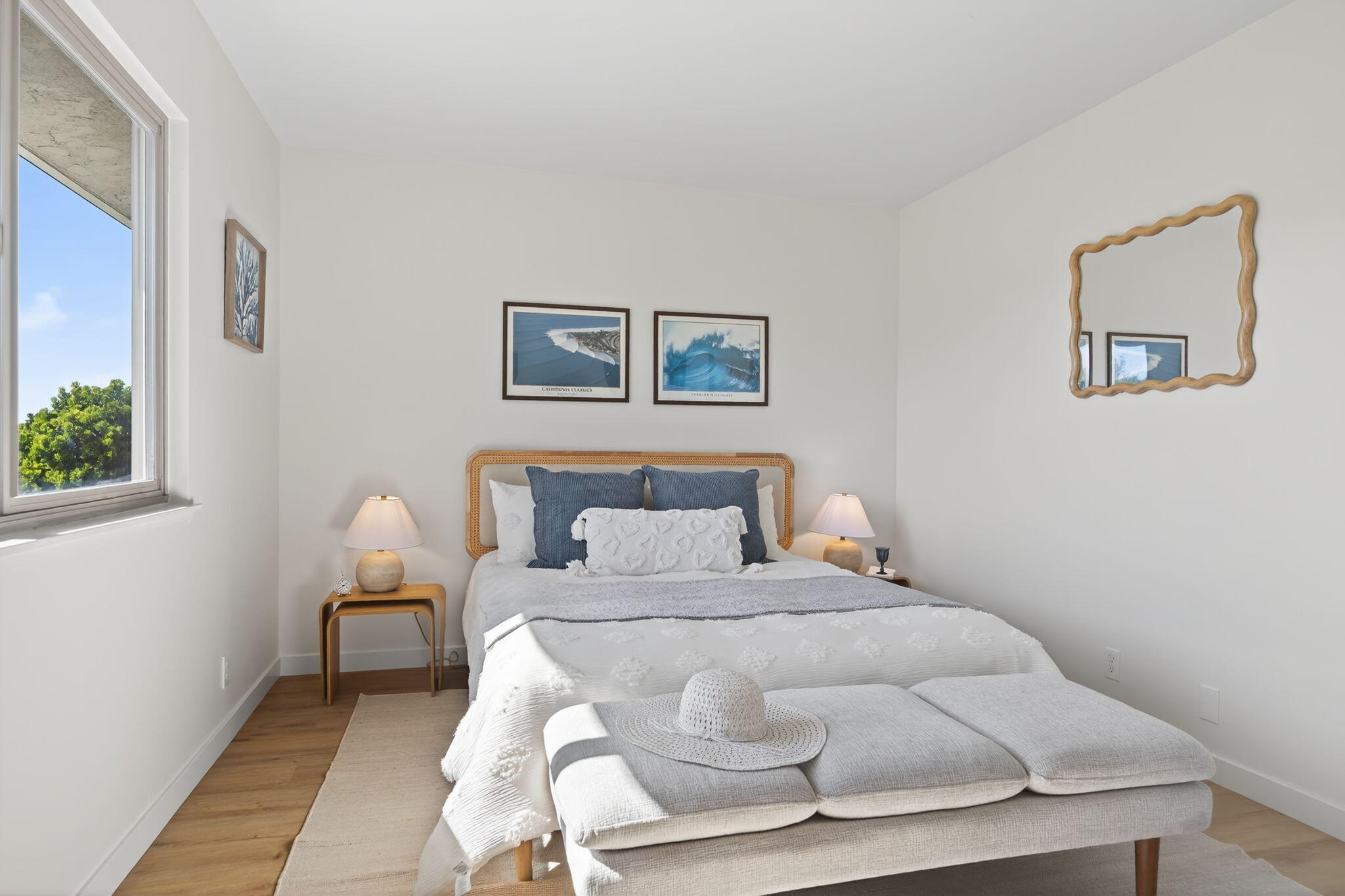 5976 Birch Street, Unit 2 Carpinteria, CA 93013 - Photo 12 of 39 a bedroom with a bed and a painting on the wall