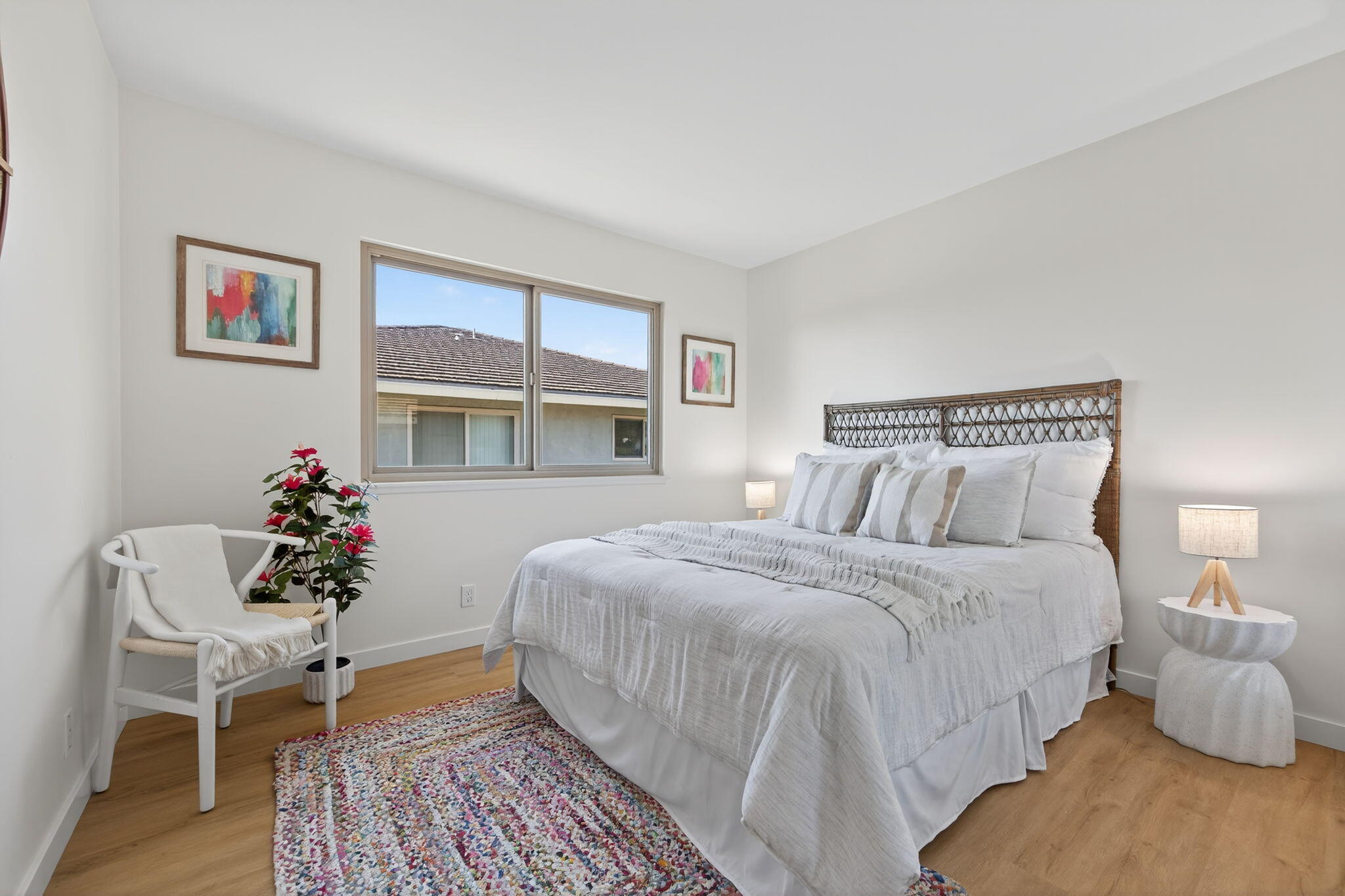5976 Birch Street, Unit 2 Carpinteria, CA 93013 - Photo 13 of 39 a bedroom with bed and a chair