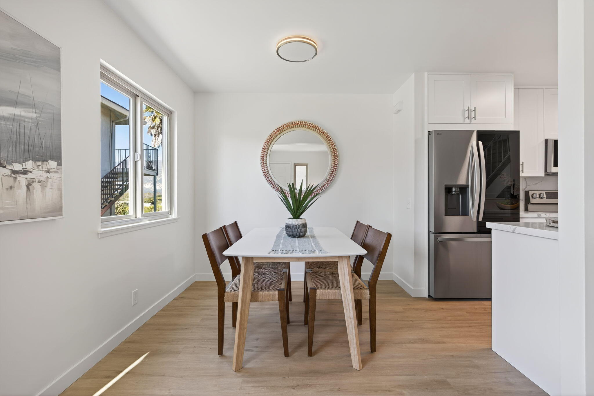 5976 Birch Street, Unit 2 Carpinteria, CA 93013 - Photo 2 of 39 a view of a dining room with furniture and a chandelier