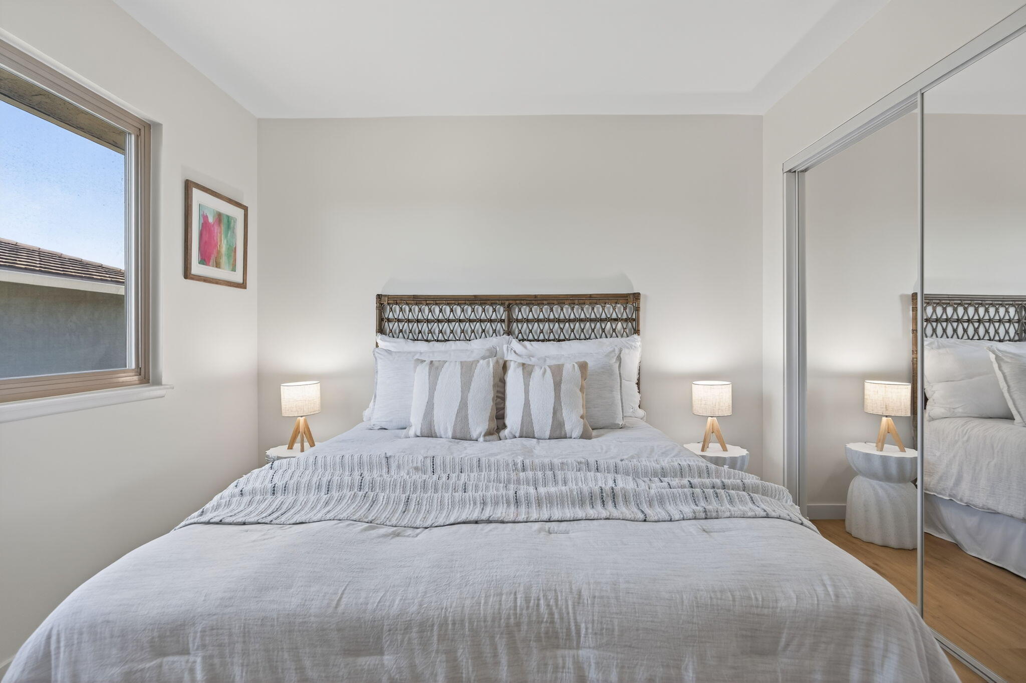 5976 Birch Street, Unit 2 Carpinteria, CA 93013 - Photo 27 of 39 a bedroom with a bed and a night lamp