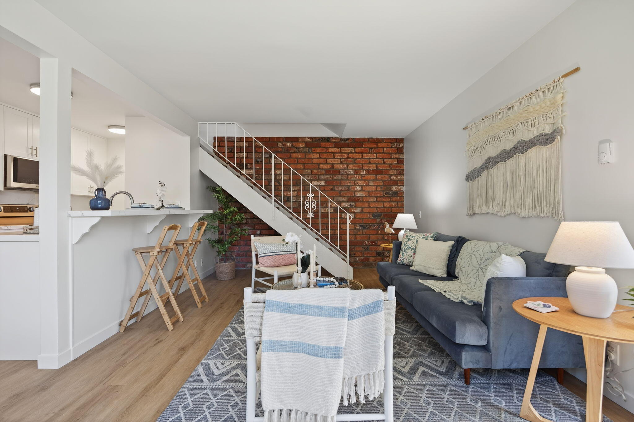 5976 Birch Street, Unit 2 Carpinteria, CA 93013 - Photo 29 of 39 a living room with furniture and a wooden floor