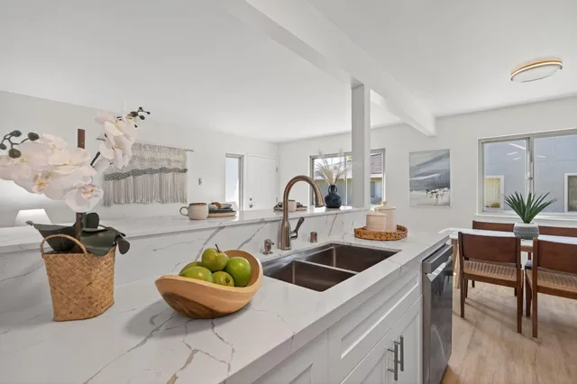 a kitchen with a sink and cabinets