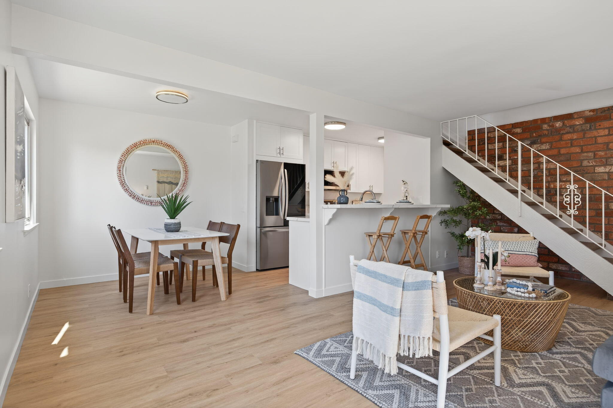 5976 Birch Street, Unit 2 Carpinteria, CA 93013 - Photo 31 of 39 a view of a dining room with furniture and wooden floor