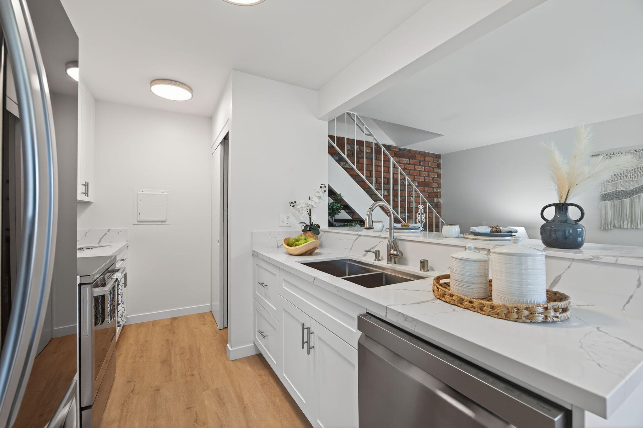 5976 Birch Street, Unit 2 Carpinteria, CA 93013 - Photo 5 of 39 a kitchen with a sink and cabinets