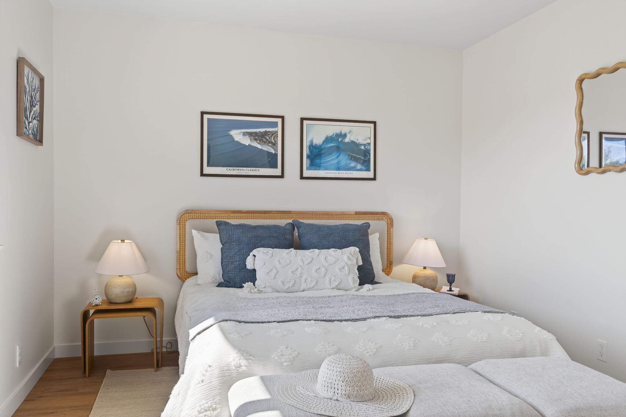 5976 Birch Street, Unit 2 Carpinteria, CA 93013 - Photo 8 of 39 a bedroom with a bed and a lamp