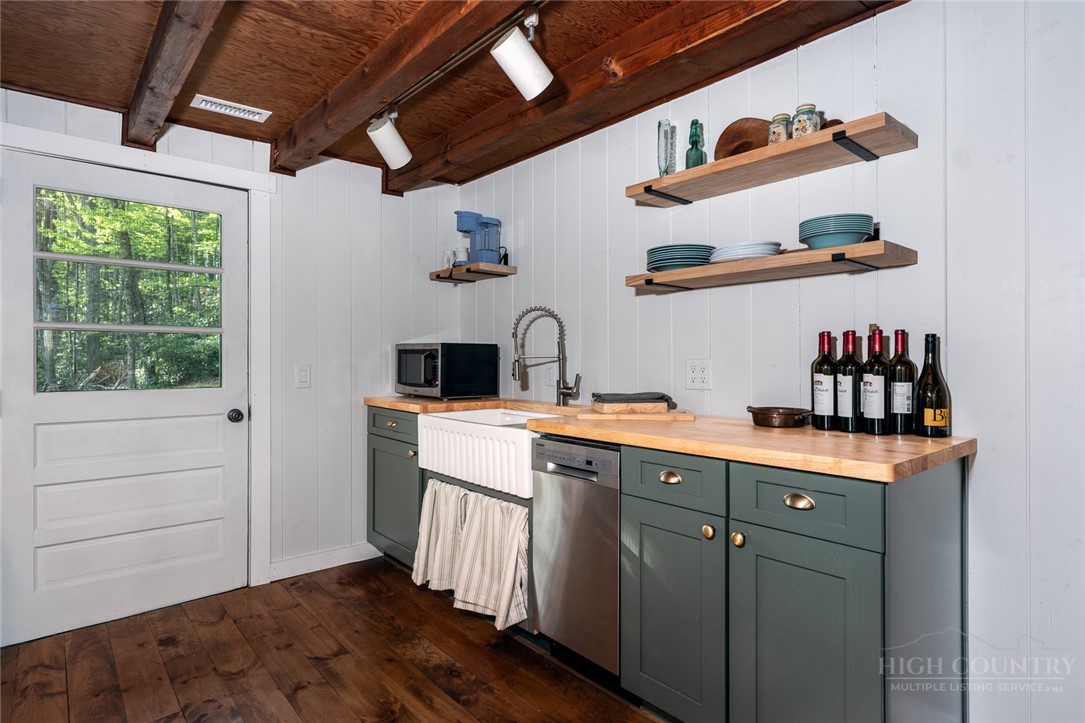 217 Holiday Hills Drive Boone, NC 28607 - Photo 16 of 26 a kitchen with a cabinets and window