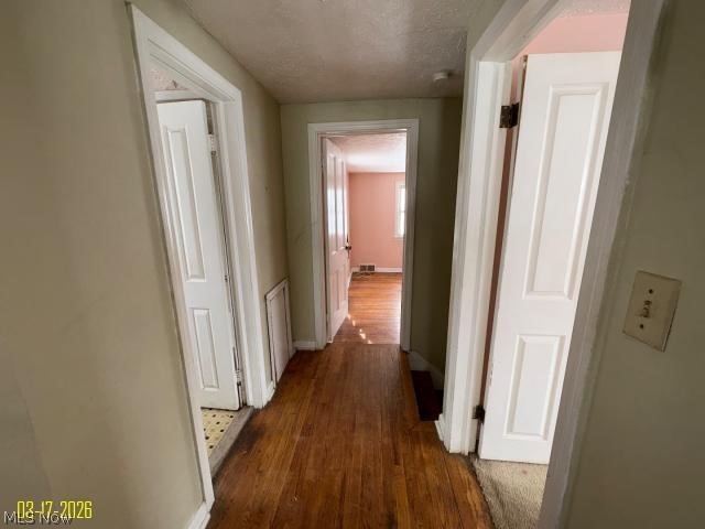 3427 Ashby Road Cleveland, OH 44120 - Photo 20 of 29 Hall with dark wood-type flooring and a textured ceiling
