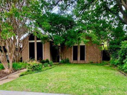 2312 Promontory Point Plano, TX 75075 - Photo 1 of 1 a view of a house with a yard and large trees