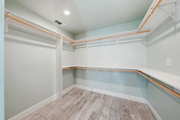 a bathroom with a sink vanity and a mirror