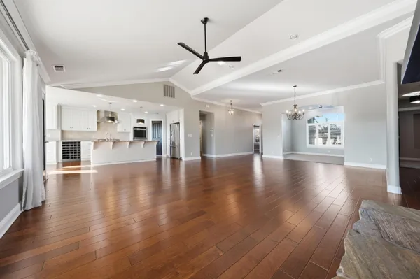 a kitchen with kitchen island a sink and a stove