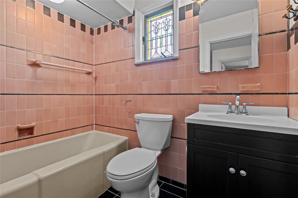 2727 Mt Royal Road Pittsburgh, PA 15217 - Photo 24 of 33 This bathroom offers a combination soaking tub and shower and also beautiful stained glass.