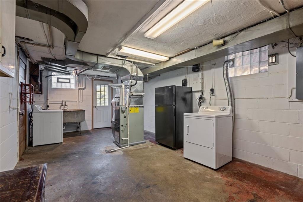2727 Mt Royal Road Pittsburgh, PA 15217 - Photo 26 of 33 23 foot laundry room with glass block windows and a walkout to the lovely yard.
