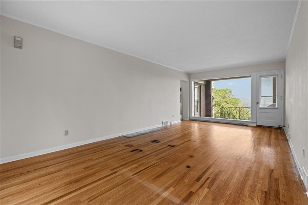 This 23 foot living room boasts a picture window with an awesome view.