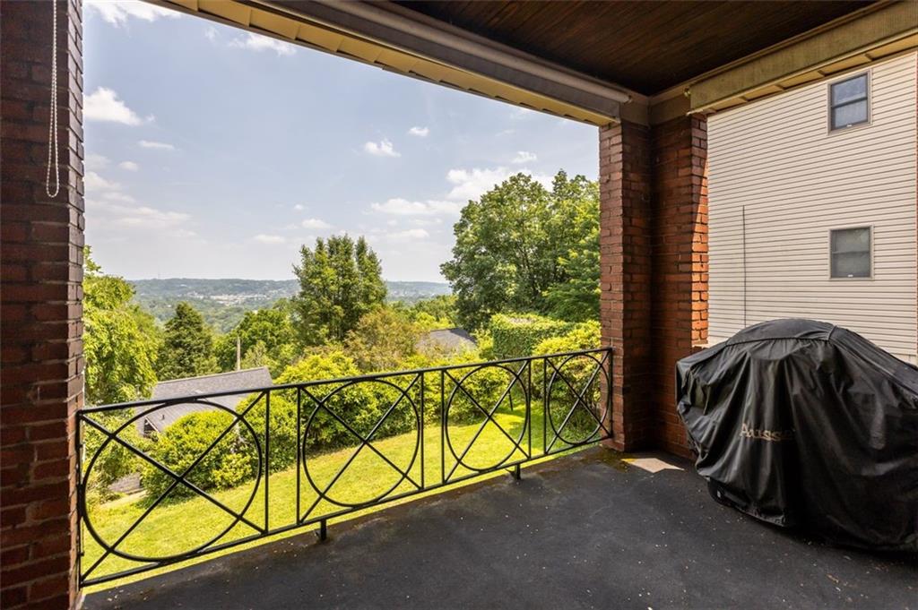 Covered deck accommodates comfortable furniture for enjoying the fresh air.