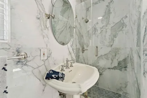 a bathroom with a sink and mirror
