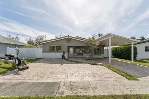 a front view of house with yard outdoor seating and barbeque oven