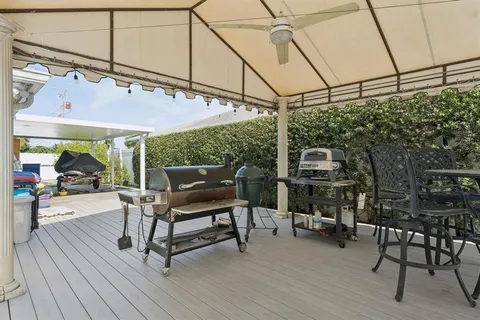 a view of a chairs and table in a patio