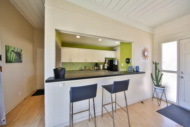 a kitchen with a table and chairs in it