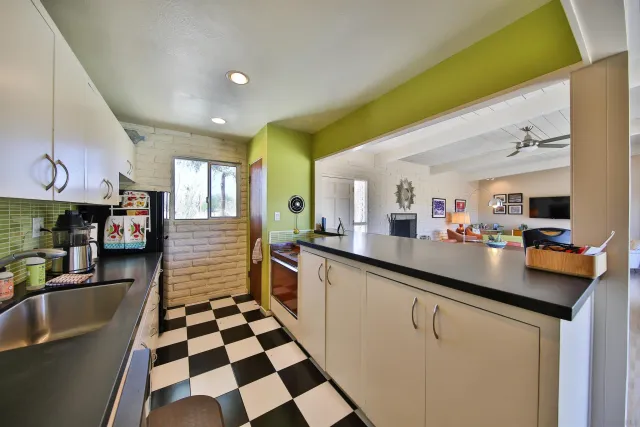 a kitchen with stainless steel appliances granite countertop a sink and cabinets