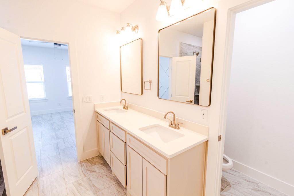 540 Highview Court Godley, TX 76044 - Photo 14 of 23 a bathroom with a sink and a mirror