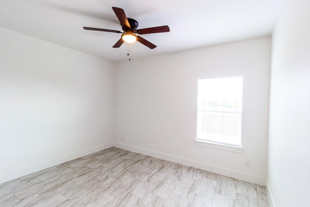 540 Highview Court Godley, TX 76044 - Photo 17 of 23 an empty room with a window