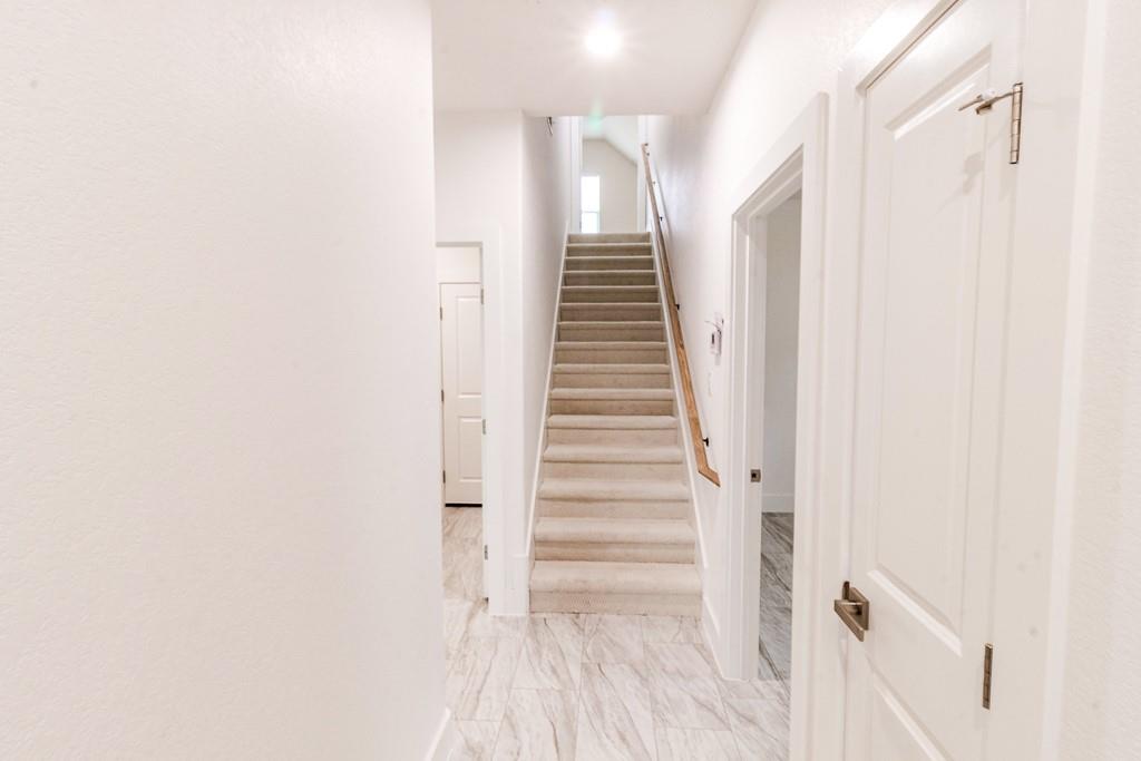 540 Highview Court Godley, TX 76044 - Photo 19 of 23 a view of a hallway with staircase