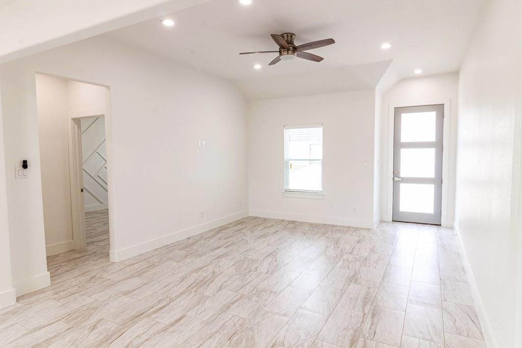 540 Highview Court Godley, TX 76044 - Photo 3 of 23 wooden floor in an empty room with a window