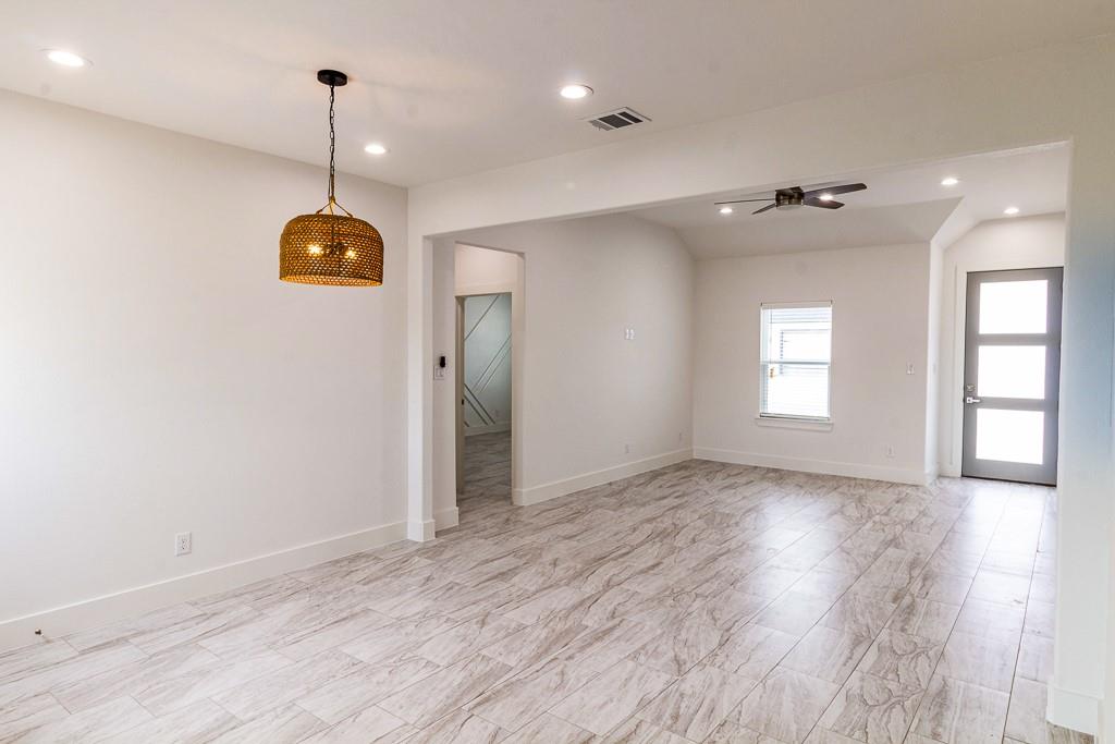 540 Highview Court Godley, TX 76044 - Photo 4 of 23 an empty room with wooden floor and window