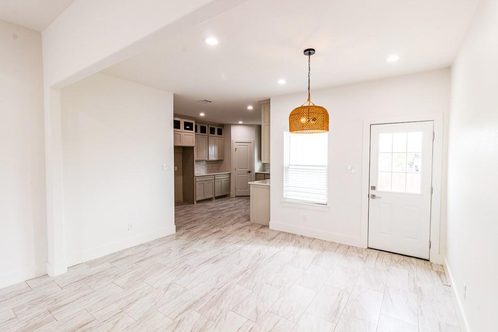 540 Highview Court Godley, TX 76044 - Photo 5 of 23 a view of a room with cabinet and windows