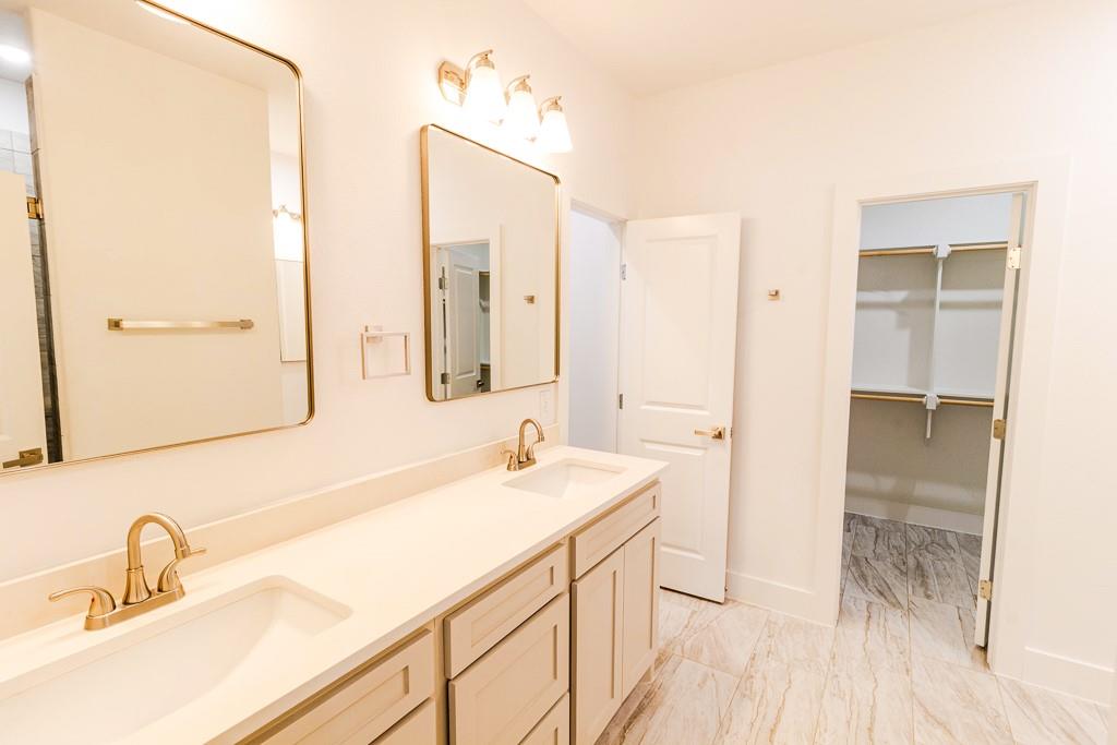 540 Highview Court Godley, TX 76044 - Photo 9 of 23 a bathroom with a sink and a mirror