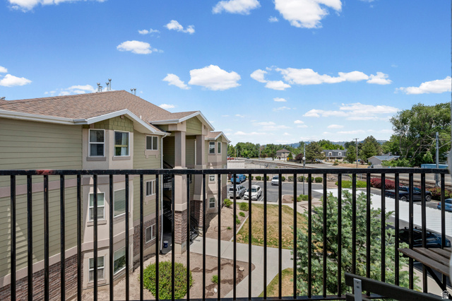 8248 South Resaca Drive, Unit J10 Sandy, UT 84070 - Photo 37 of 40 Balcony offering outdoor space with black metal railings