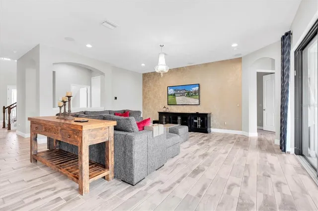 a kitchen with a stove a refrigerator and cabinets