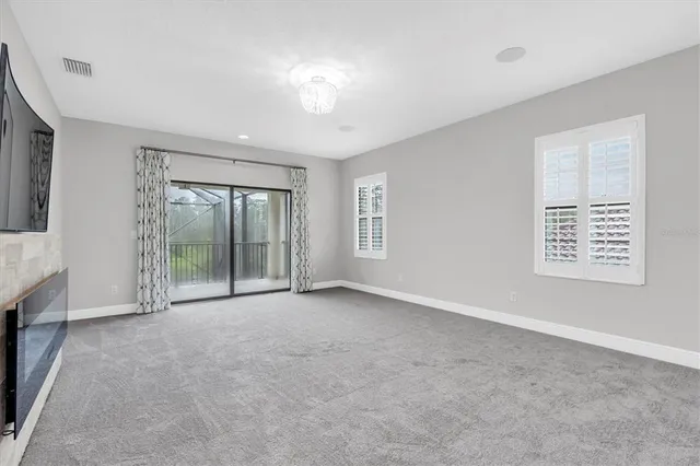 a bathroom with a granite countertop sink and a bathtub