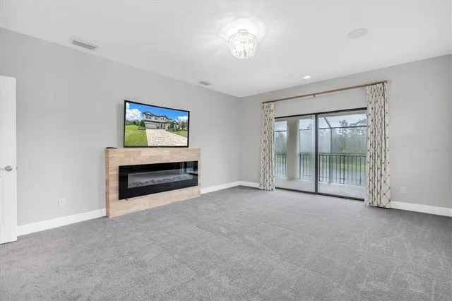 a view of a patio with a table and chairs under an umbrella