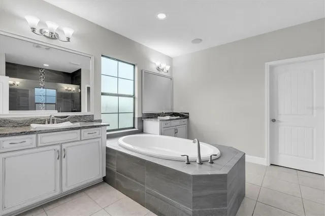 a swimming pool with patio outdoor seating and yard