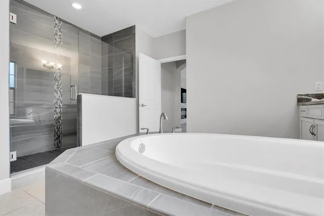 an aerial view of residential houses with outdoor space and swimming pool