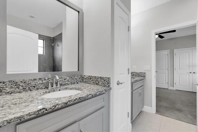 an aerial view of a house with a yard and lake view