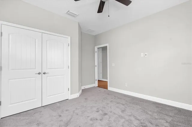 an aerial view of a residential apartment building with a yard