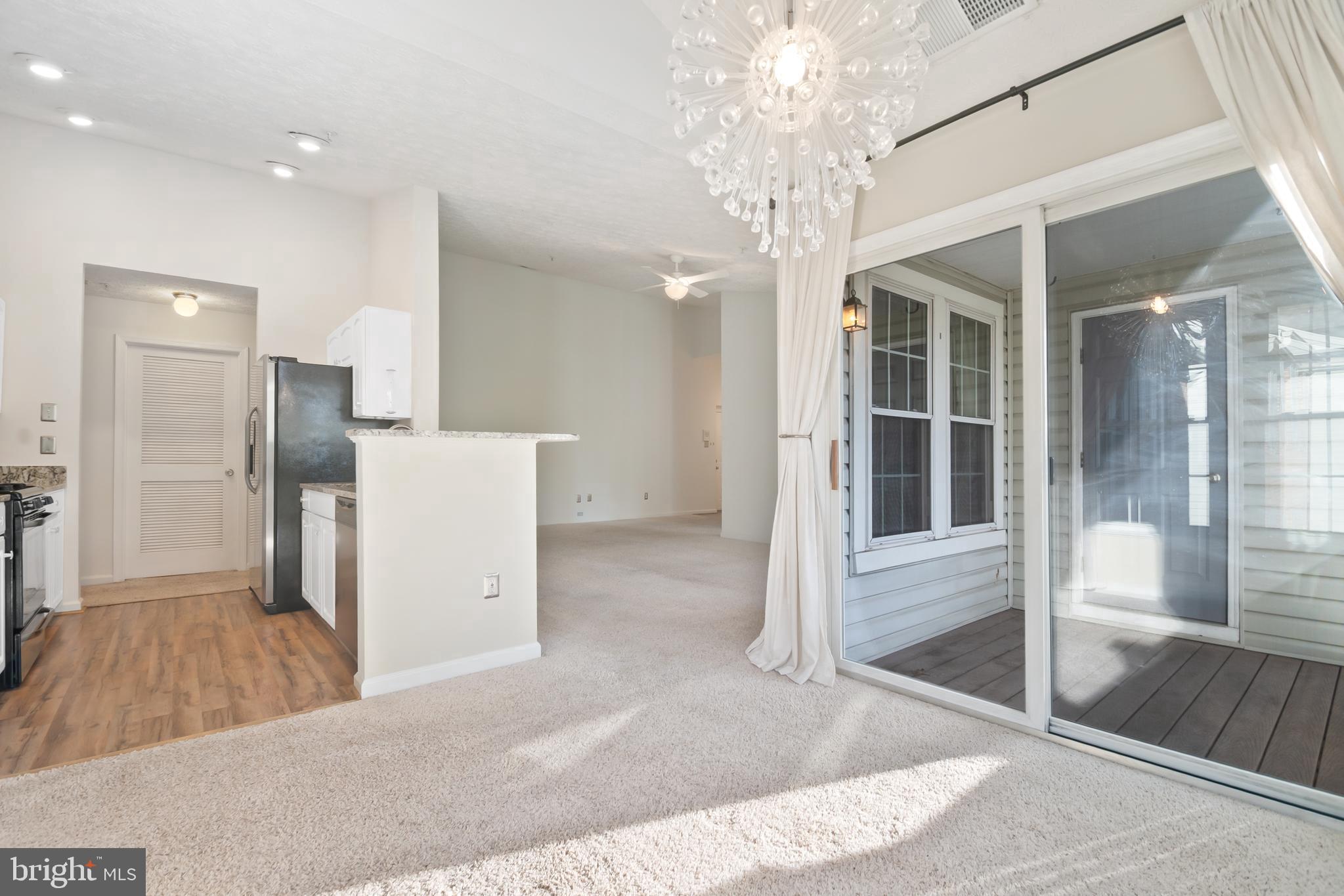 8265 Poplar Mill Road, Unit 8265 Nottingham, MD 21236 - Photo 12 of 35 a view of a hallway with a chandelier