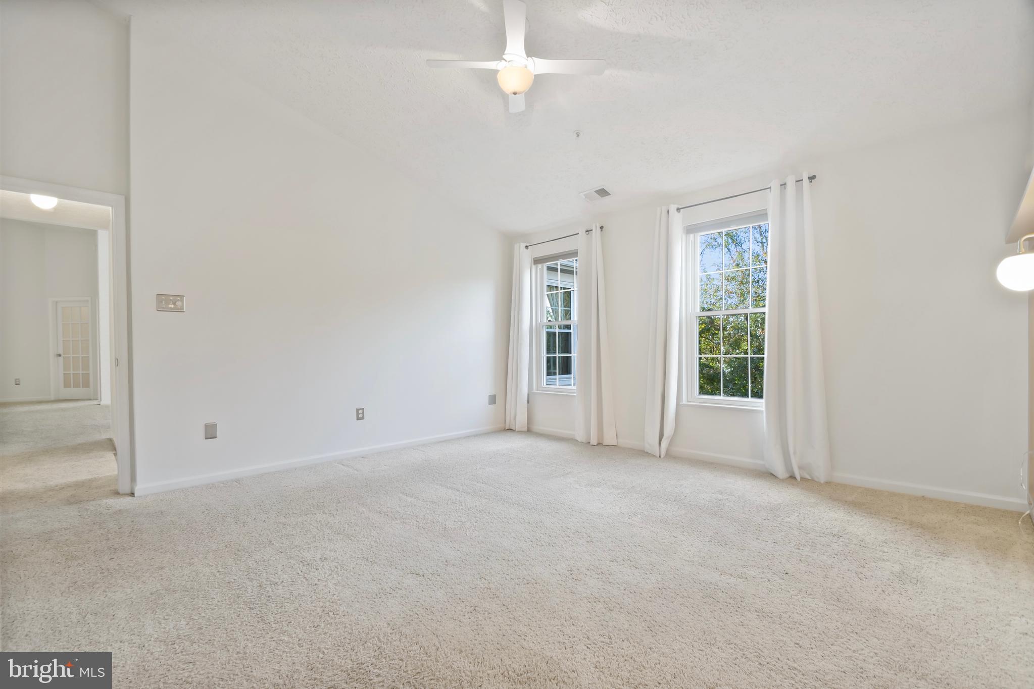 8265 Poplar Mill Road, Unit 8265 Nottingham, MD 21236 - Photo 17 of 35 an empty room with windows and closet