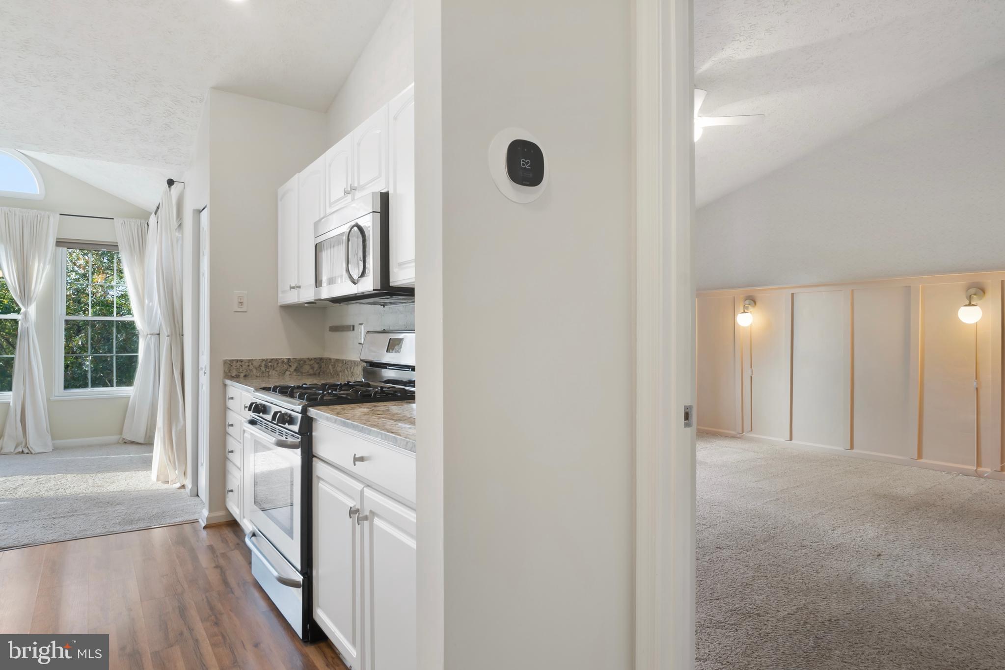 8265 Poplar Mill Road, Unit 8265 Nottingham, MD 21236 - Photo 20 of 35 a kitchen with stainless steel appliances granite countertop a stove and a sink