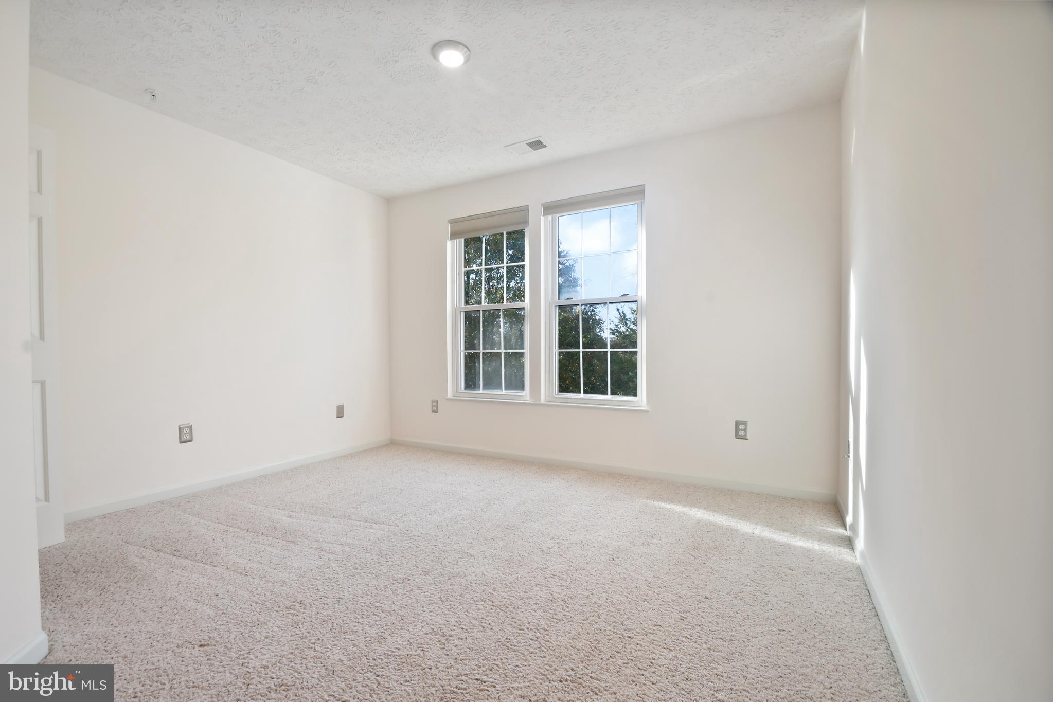8265 Poplar Mill Road, Unit 8265 Nottingham, MD 21236 - Photo 21 of 35 an empty room with windows